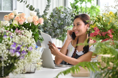 Young Asian woman entrepreneur/shop owner/ florist of a small flower shop business