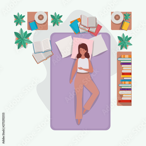 young woman relaxing in mattress in the bedroom