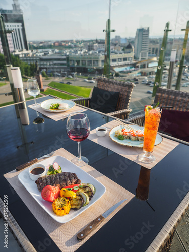 Sky cafe on the roof terrace with view of modern city