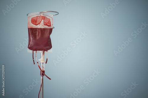 transfusion of blood, bag with red blood cells on stand