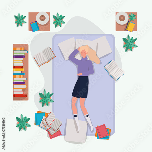 young woman relaxing in mattress in the bedroom