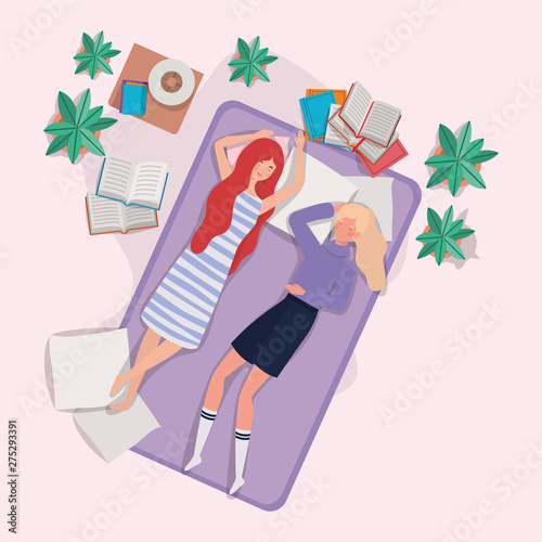 young women relaxing in mattress in the bedroom