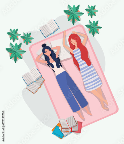 young women relaxing in mattress in the bedroom