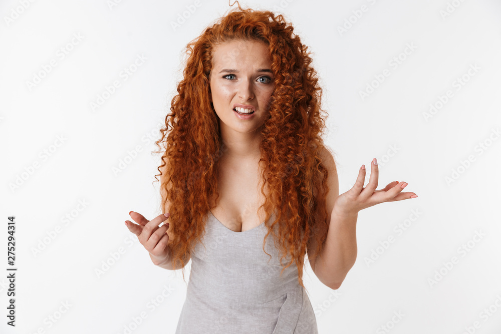 Portrait of an attractive woman with long curly red hair Portrait of an attractive woman with long curly red hair