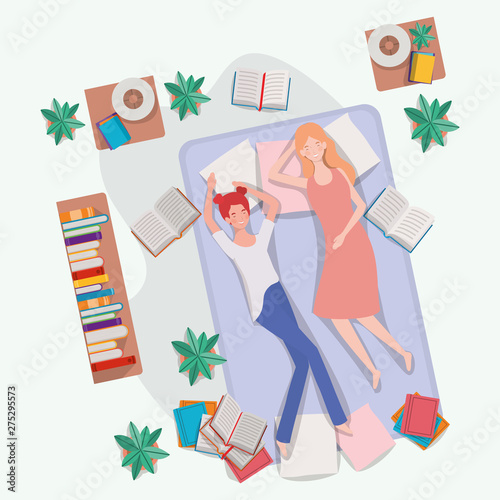 young women relaxing in mattress in the bedroom