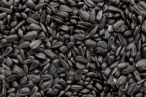 Black sunflower seeds. Black sunflower seeds for texture or background. Black sunflower seeds macro close up