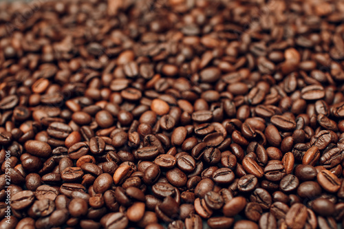 Roasted coffee beans brown seeds texture background wallpaper.