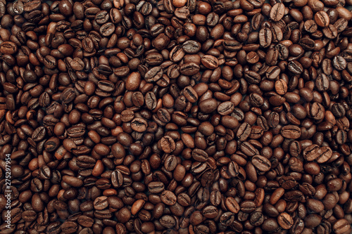 Roasted coffee beans brown seeds texture background wallpaper.