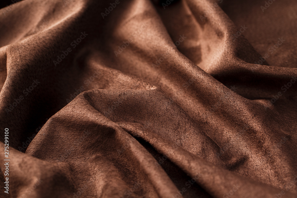 Brown velor textural background pattern. Gorgeous elastic velor fabric has a velvet pile, shine and texture. Brown velor textural background pattern. Gorgeous elastic velor fabric has a velvet pile, shine and texture.
