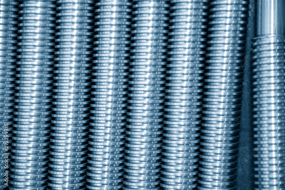 Close-up scene texture of the lead screw spare parts. The CNC machine parts manufacturing concept. Close-up scene texture of the lead screw spare parts. The CNC machine parts manufacturing concept.