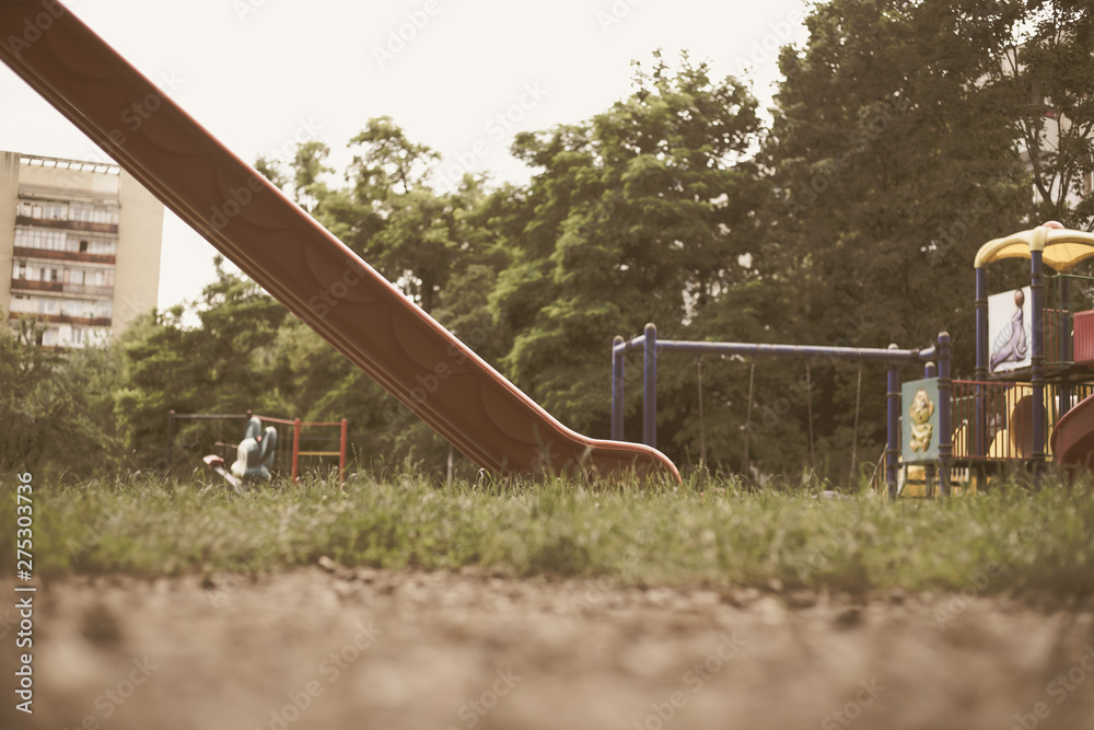 Tall plastic slide in a playground for kids in the park – Relaxation and fun place for children with different activities Tall plastic slide in a playground for kids in the park – Relaxation and fun place for children with different activities