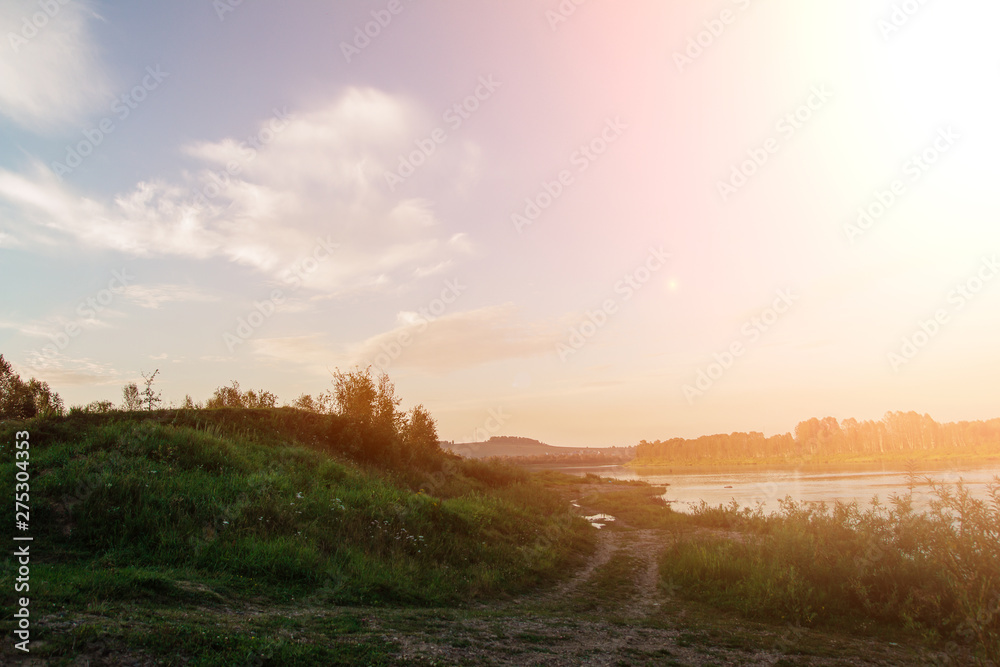 sunset on the river. A beautiful mountain hill near the beach. park and rest