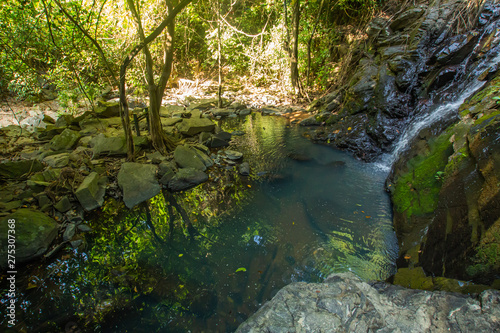 Ton Aow Yon Waterfall rich natural resources in the forest asia tropical areaat Island Phuket Thailand.