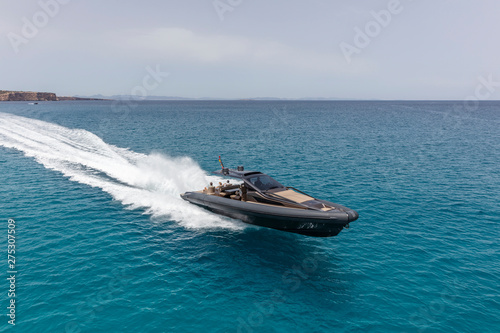 Obraz na płótnie inflatable motor boat in formentera, spain w salonie