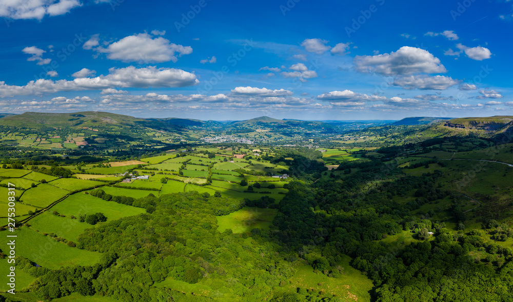 Aerial panorama of green fields and farmland in rural South Wales