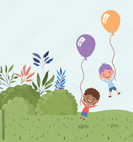 interracial boys with balloons helium in the landscape