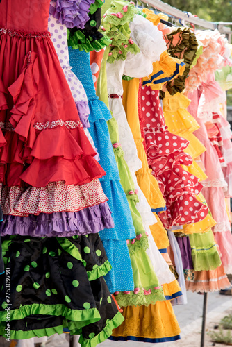 Colorful sevillana costumes at a street market in Spain