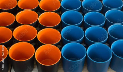 Orange inside and black outside ceramic mugs for input drink water or coffee,blue ceramic mugs horizontal set twotone color.