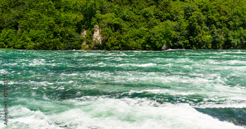 A beautiful waterfall on the river Rhine in the city Neuhausen am Rheinfall in northern Switzerland. The Rhine Falls is the largest waterfall in Europe. © Michal