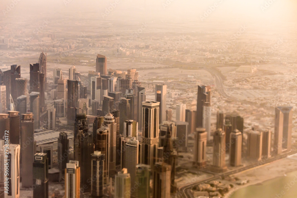 Downtown aerial view of Doha, Qatar taken through tilt shift lens.
