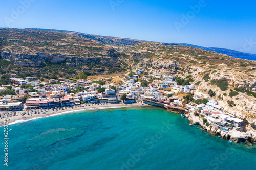 Matala beach with caves on the rocks that were used as a roman cemetery and at the decade of 70's were living hippies from all over the world, Crete, Greece © gatsi
