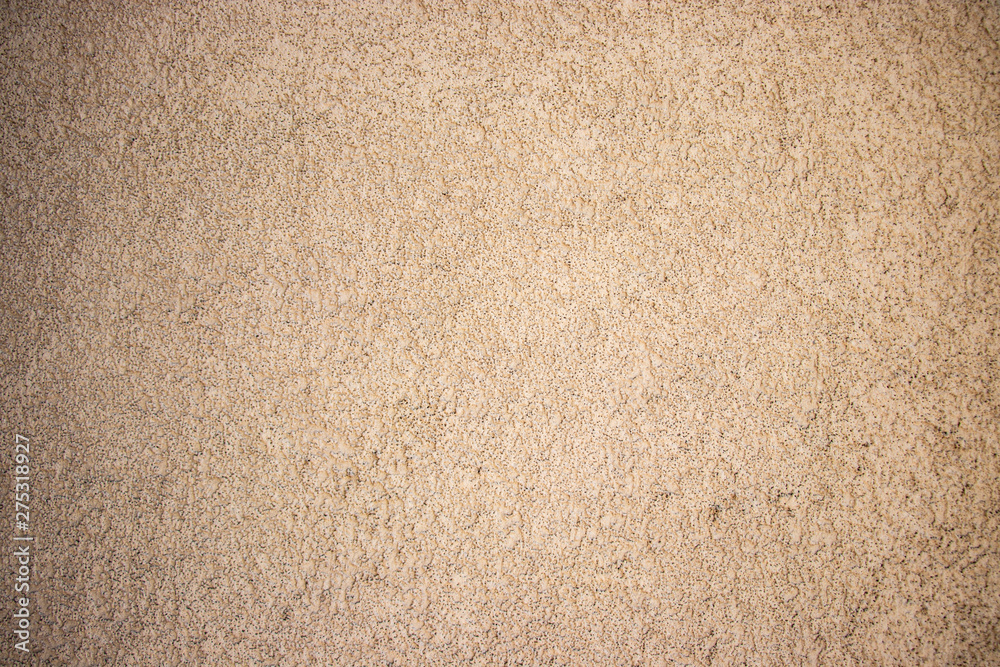 Beige painted grunge wall rough texture Beige painted grunge wall rough texture