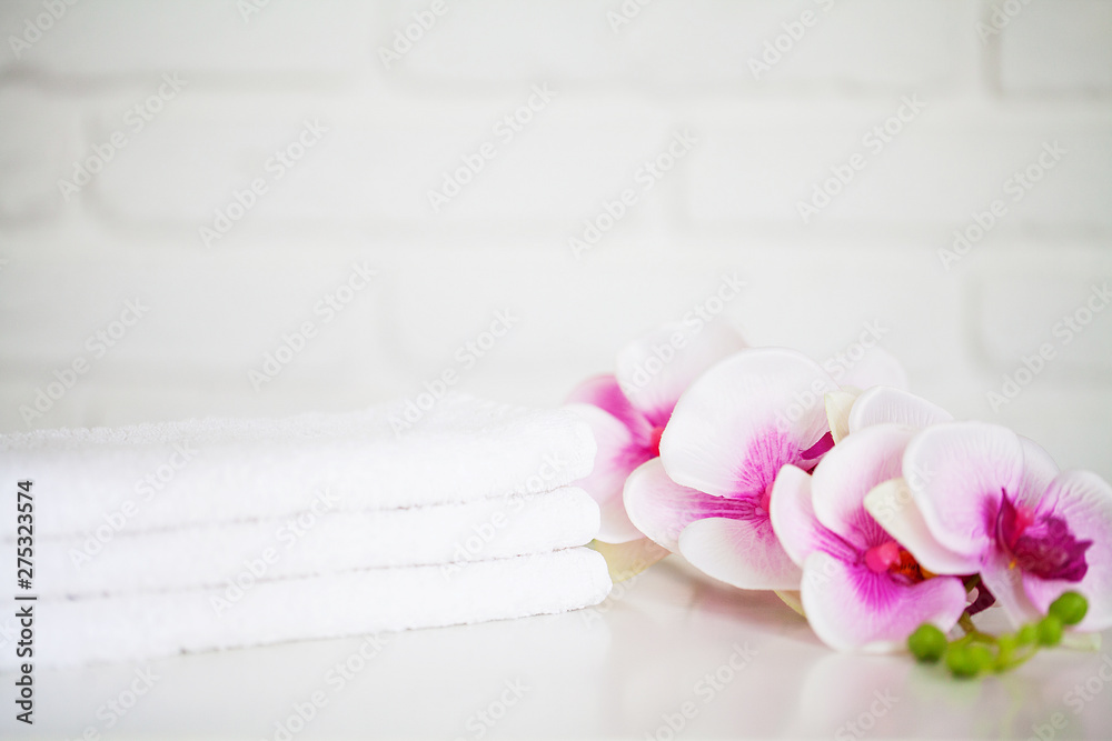 White towels on white table with copy space on bath room background White towels on white table with copy space on bath room background