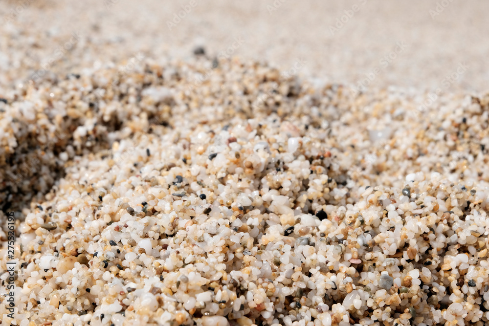 The sand on the beach. Texture or background. Footprints in the dirty yellow sand. Tourist holiday concept. The sand on the beach. Texture or background. Footprints in the dirty yellow sand. Tourist holiday concept.