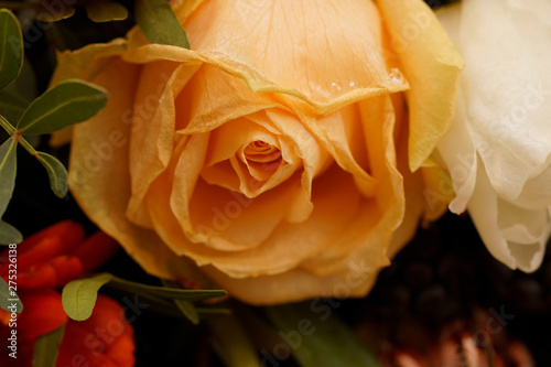 Macro on frozen yellow and white roses. Beautiful Funeral arrangement.