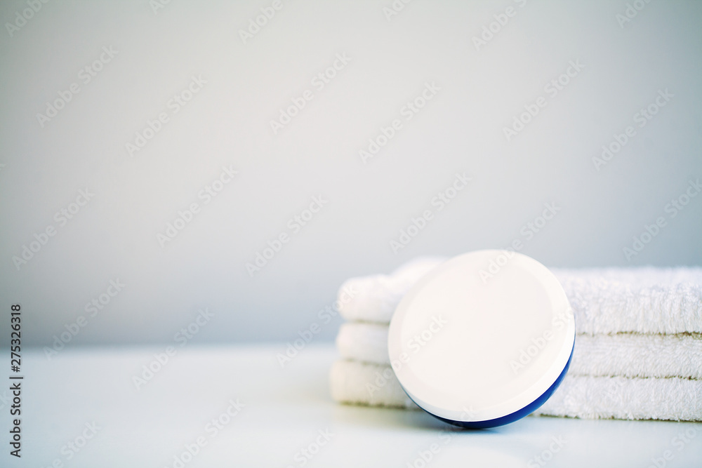 White towels on white table with copy space on bath room background White towels on white table with copy space on bath room background