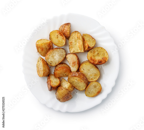 Top view of baked potatoes wedges on plate