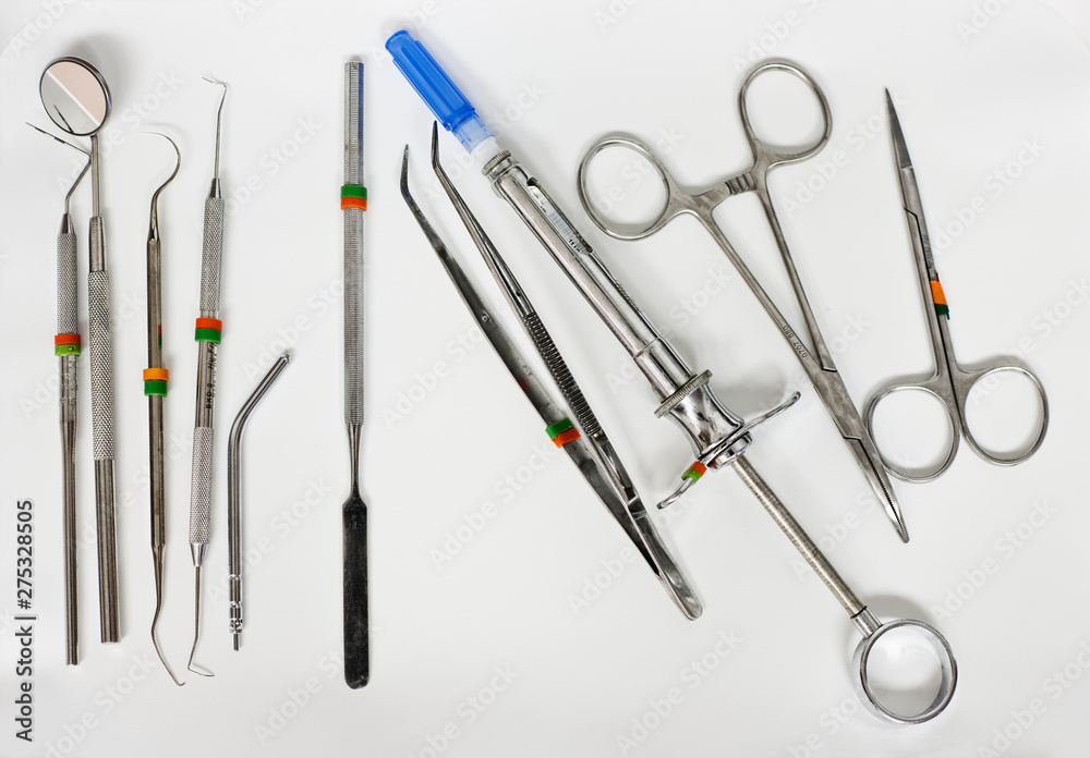 Dental Instruments on White Surface Dental Instruments on White Surface