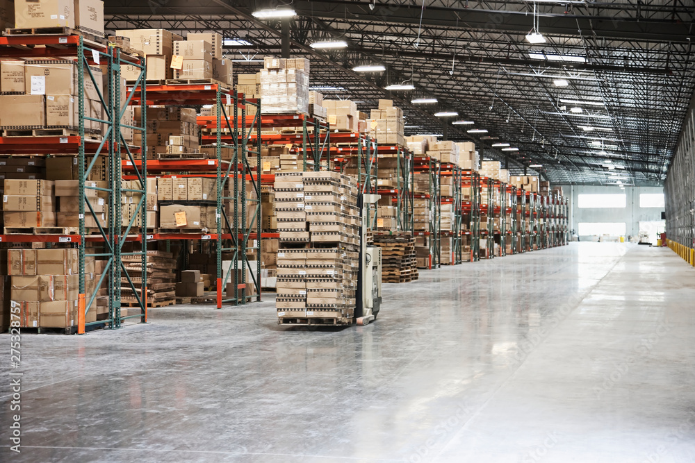 Cardboard boxes on shelves in warehouse Cardboard boxes on shelves in warehouse
