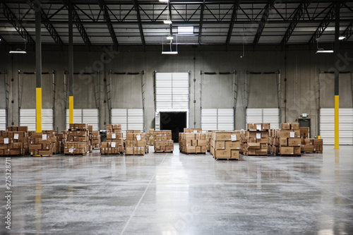 Cardboard boxes at loading dock in warehouse