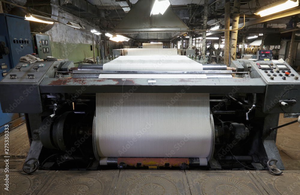 Industrial loom in textile factory Industrial loom in textile factory