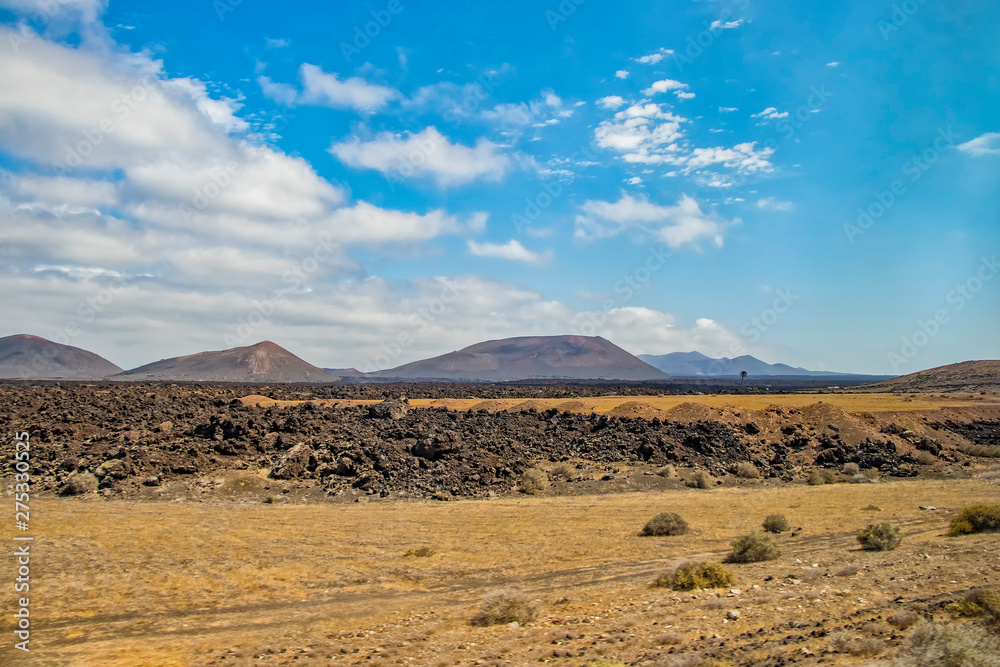 Volcanic hills in the desert landscape of the island of Lanzarote, which is a protected area of UNESCO