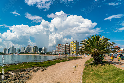 Tourist walking on Rambla (street) Claudio Wiliman towards a beach of Punta Del Este, Uruguay, January 28th 2019