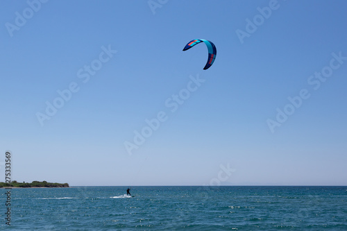 Man KiteBoarding, Fun in the ocean, Extreme Sport Kitesurfing