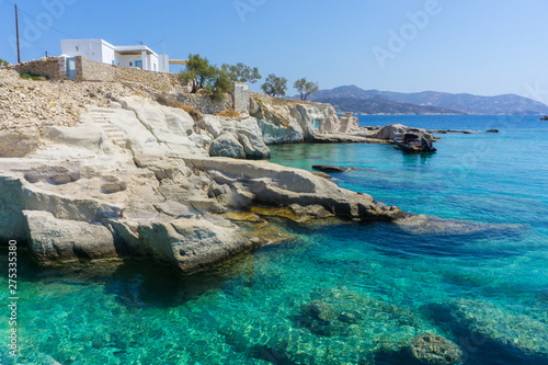 Fototapeta Naklejka Na Ścianę i Meble -  Beach with deep blue sea waters suitable for dives in Karas village in Kimolos island, Cyclades, Greece