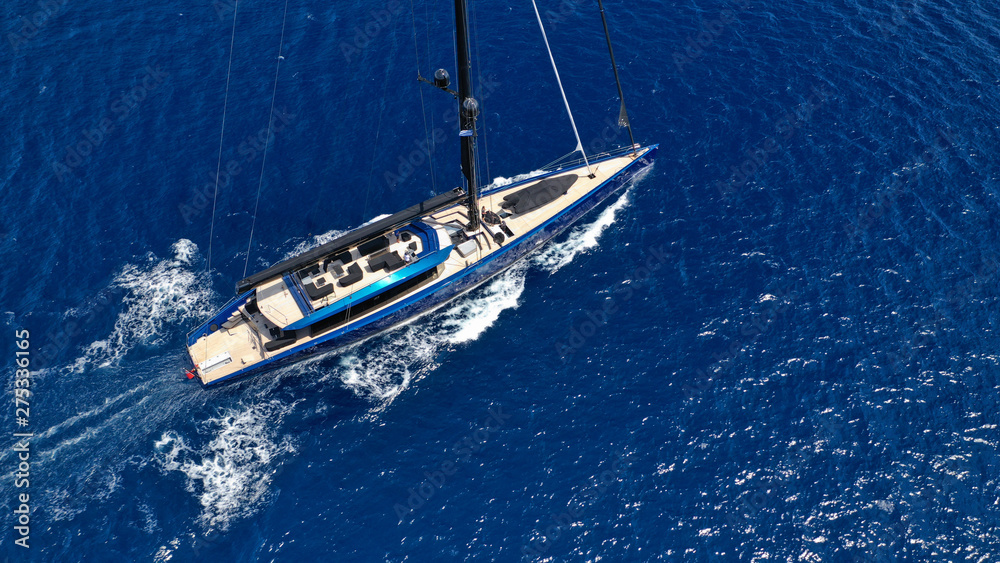 Naklejka premium Aerial photo of beautiful wooden deck sail boat cruising the Aegean blue sea, Greece