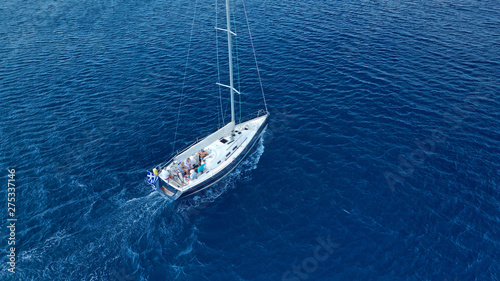 Aerial photo of beautiful wooden deck sail boat cruising the Aegean blue sea, Greece © aerial-drone