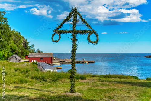 Classic midsommer pole at the coast line of Roslagen