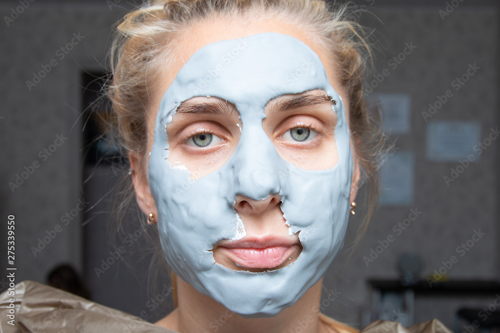 Spa Woman applying Facial clay Mask. Beauty Treatments.facial cleansing, cosmetology, beauty mask Spa Woman applying Facial clay Mask. Beauty Treatments.facial cleansing, cosmetology, beauty mask