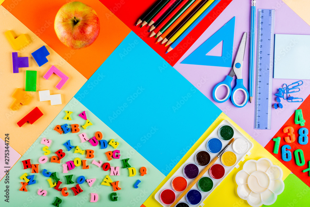 Teaching children of primary school. Bright and multicolored school background with stationery accessories for the study of general subjects. Flat Lay, Copy space, Mock up, top view, place for text.