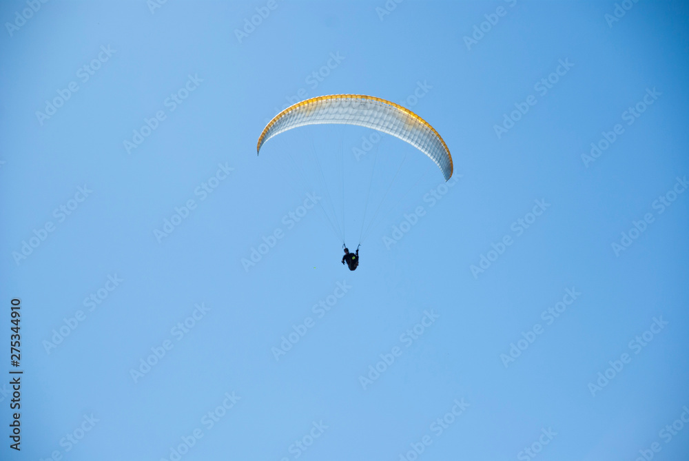 Skydivers competition. Parachutes against the blue sky. Skydivers competition. Parachutes against the blue sky.