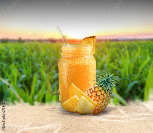 glass of Pineapple juice on wooden table