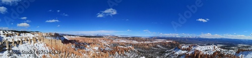 winter mountain landscape with snow on Bryce Canyon, trees and blue sky