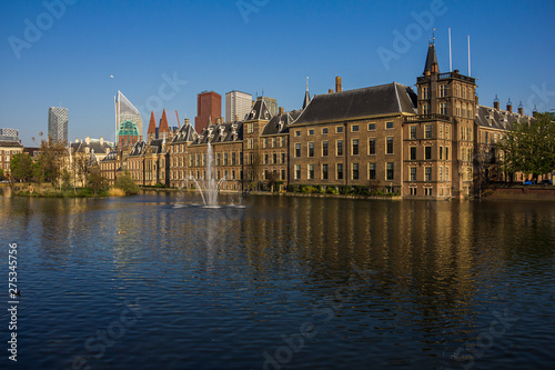 the Hague (den Haag), the Netherlands, Holland,, April 20, 2019. Binnenhof palace (Dutch Parliament), Mauritstoren (tower of Maurits) pond with fountain view side