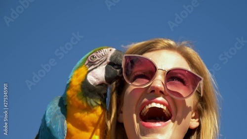 Blonde Model Laughs as Parrot Removes Her Pink Sunglasses