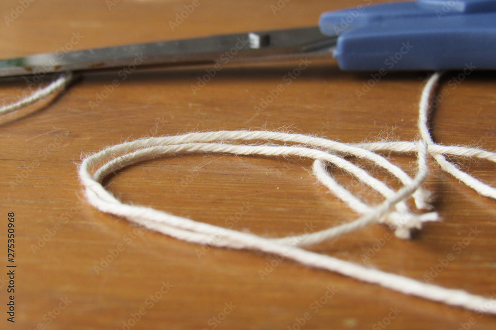 Scissor and twine layed at a craftsman table Scissor and twine layed at a craftsman table